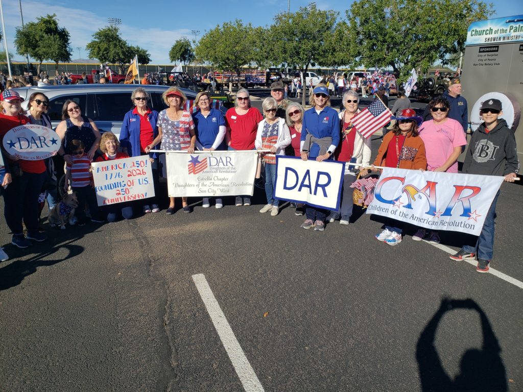 Members participating in Veterans Day Parade with other DAR chapters and Children of the American Revolution (C.A.R.).